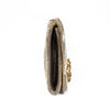 Gold clutch bag with intricate detailing on a white background