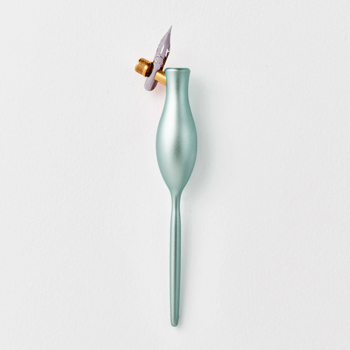 Green pen with a gold flange and silver nib on a white background