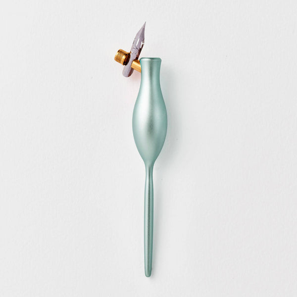 Green pen with a gold flange and silver nib on a white background