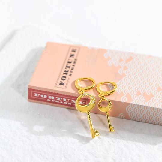Boucles d'oreilles asymétriques | Clé de Fa