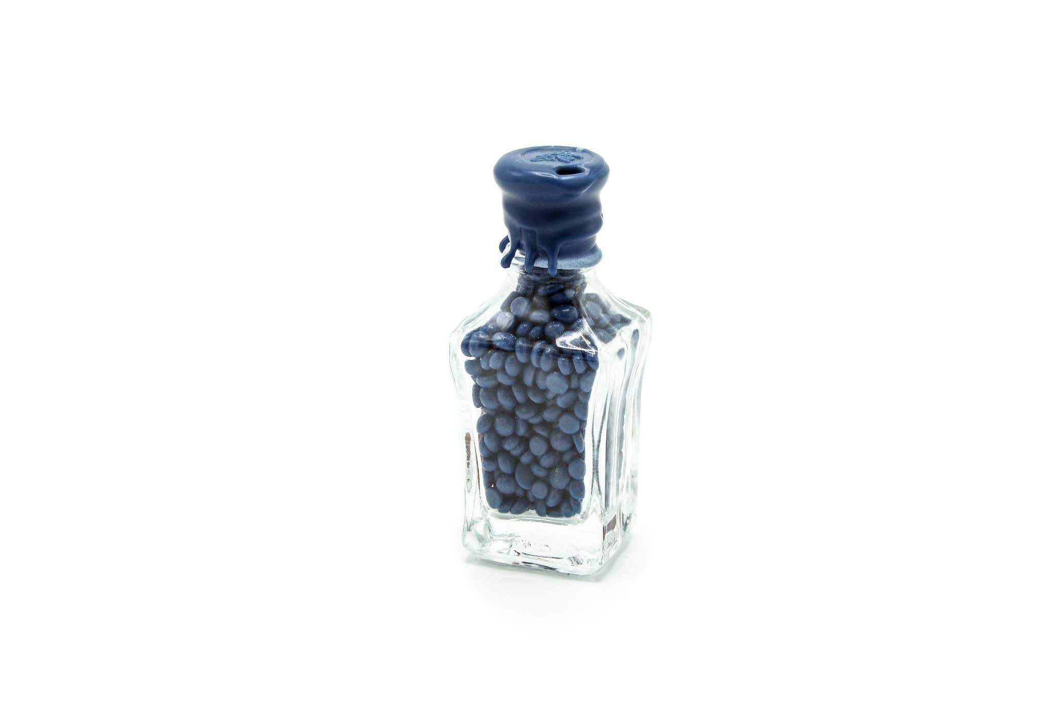 Perles de cire dans une bouteille {plusieurs couleurs}