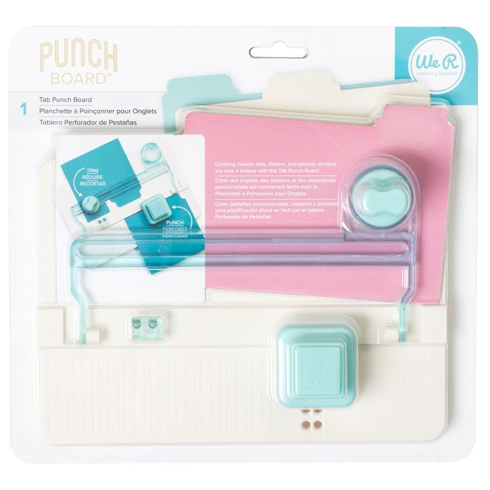 A Tab Punch Board by We R Makers, displayed in packaging, with components visible in aqua and pink colors.