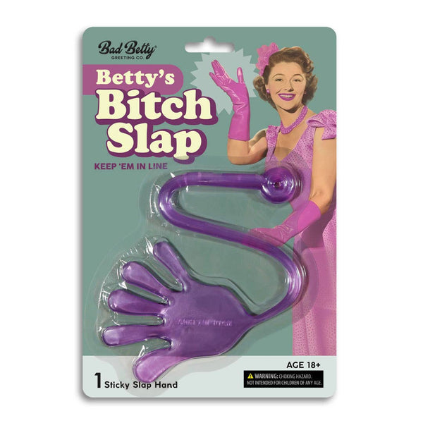 Packaged product with purple hand-shaped slap and retro-style packaging featuring a woman.