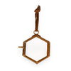 Hexagonal gold frame on a white background