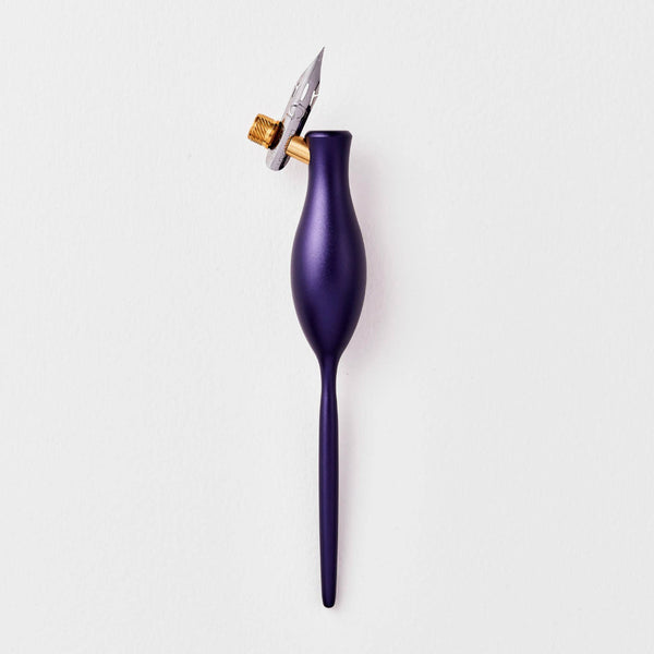 Purple calligraphy pen with a gold clip on a white background