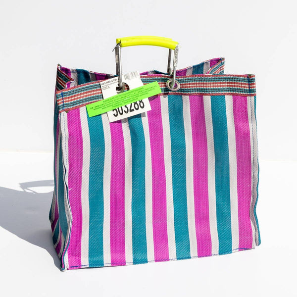 Striped bag with a colorful handle on a white background