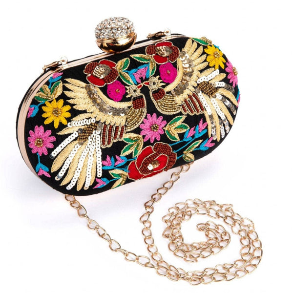 Decorative clutch bag with floral and bird design on a white background