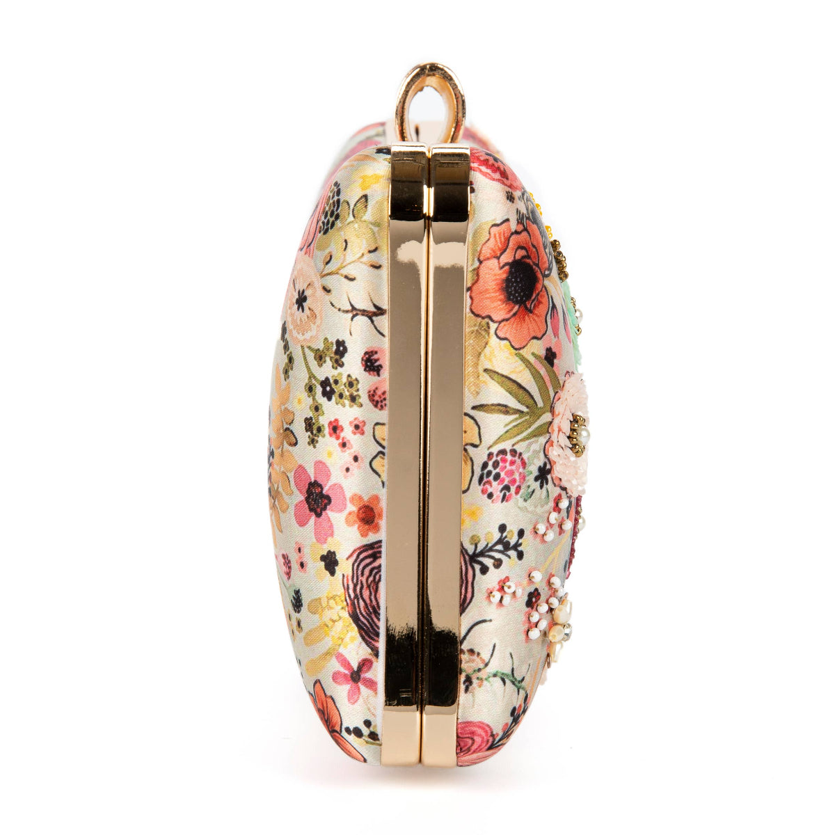 Floral patterned clutch bag with gold accents on a white background