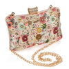 Floral patterned clutch bag with gold chain strap on a white background