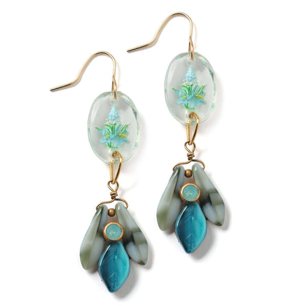Pair of earrings with floral design and turquoise leaves on a white background
