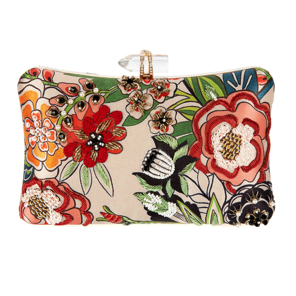 Floral embroidered clutch bag with colorful flowers on a beige background
