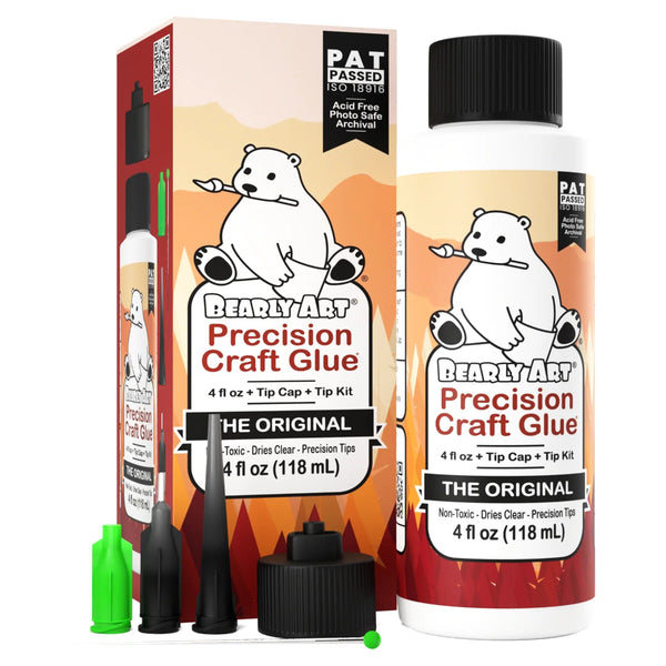 A bottle of Bearly Art Precision Craft Glue with a tip kit, alongside its packaging box featuring a white polar bear illustration.
