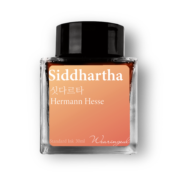 Ink bottle labeled 'Siddhartha' by Hermann Hesse with a black cap on a white background
