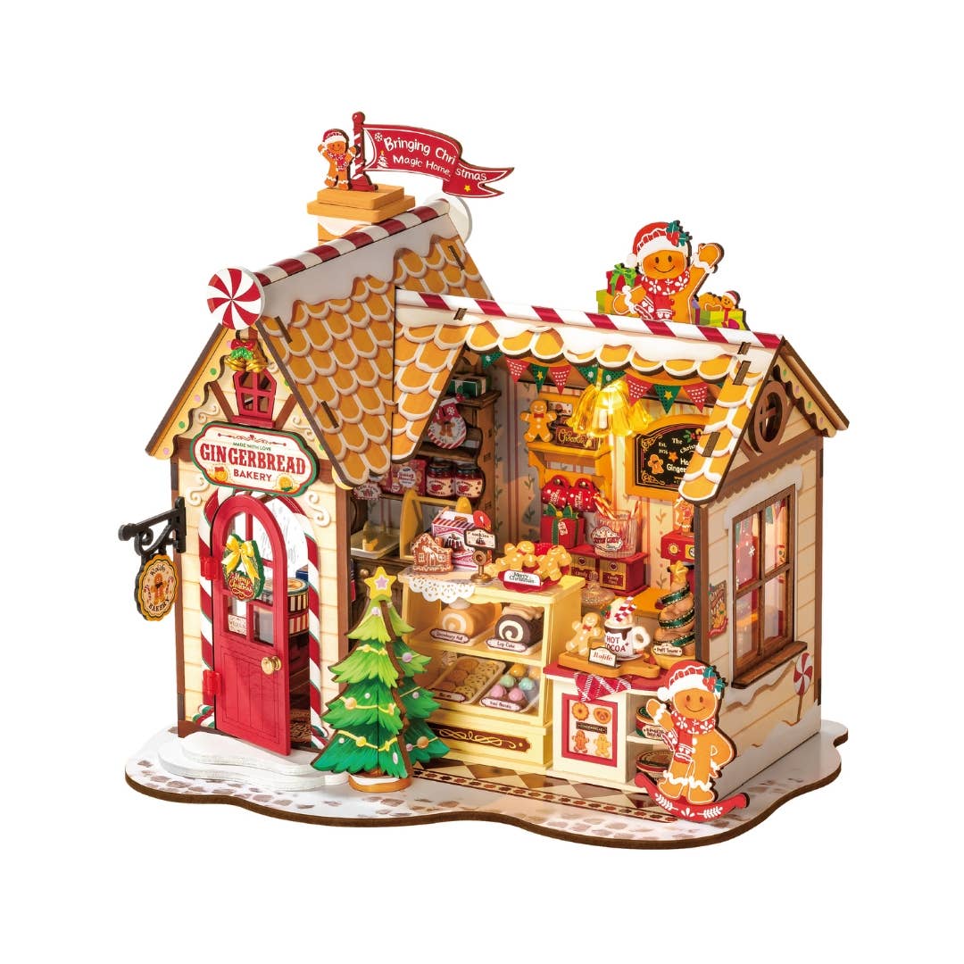 Gingerbread house model with decorative elements on a white background