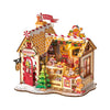 Gingerbread house model with decorative elements on a white background