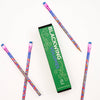 A set of colorful patterned pencils arranged around a green rectangular box labeled 'BLACKWING VOLUMES' on a clean white background.