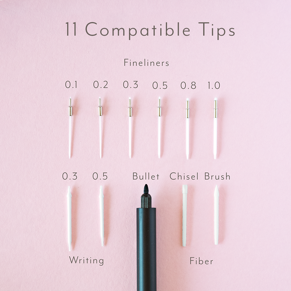 Pen with interchangeable tips on a pink background