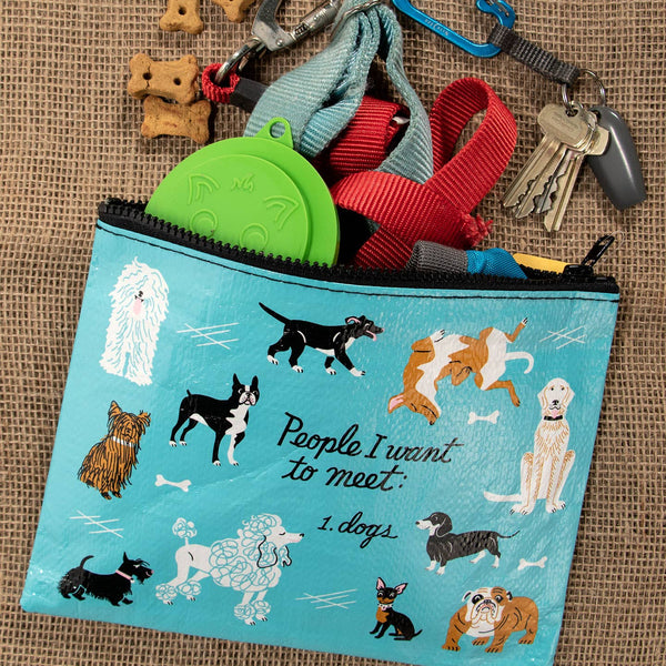 Dog accessory pouch with dog-themed design on a textured surface