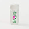 A white insulated travel tumbler with a matching white lid, featuring a vertical green vine pattern and a pink flower graphic on the front.