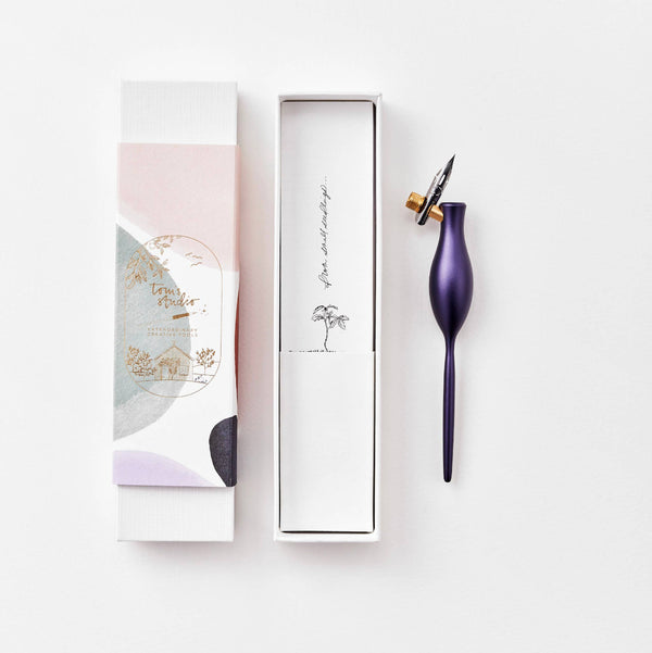Purple pen with packaging on a white background