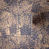 Book cover of 'Pride and Prejudice' by Jane Austen on a patterned fabric background